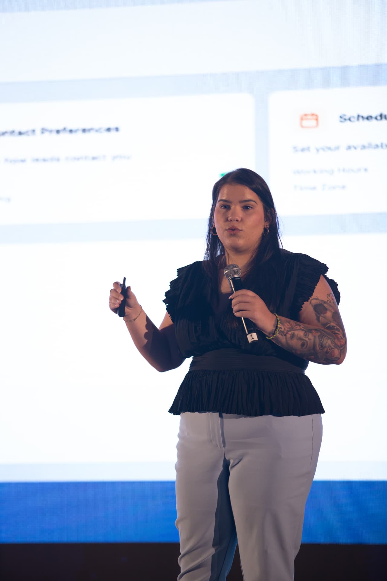 Amanda Diaz presenting a product demo on stage